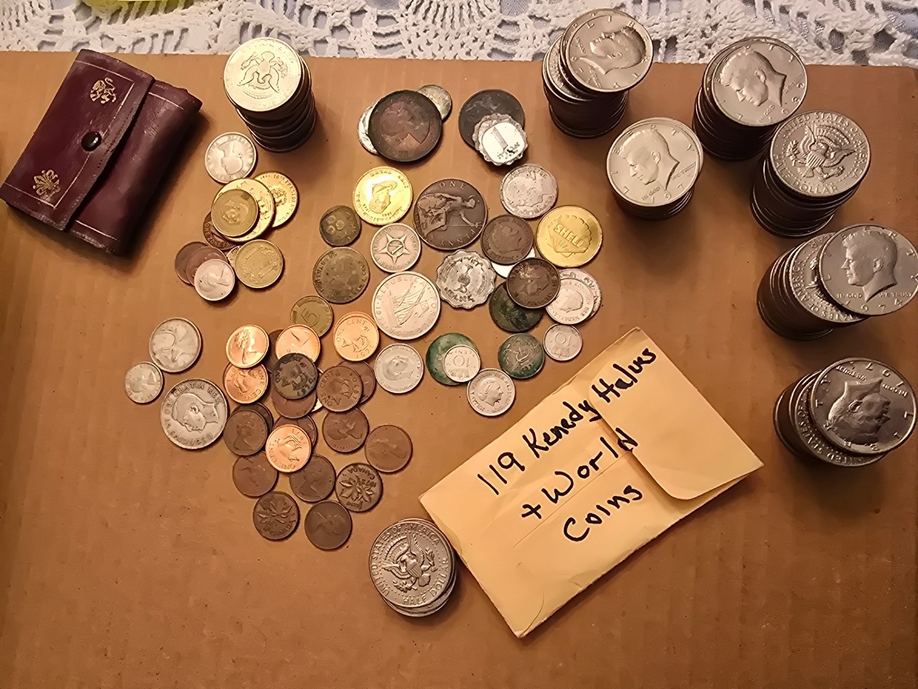 Assorted world coins and Kennedy half-dollars - image 1 of 9