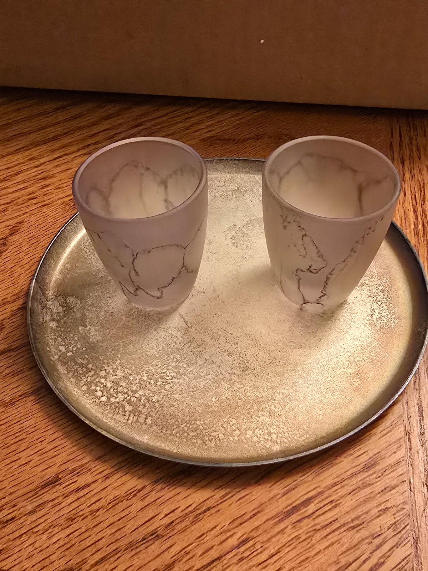 Two marble-pattern glass cups on a metal tray - image 1 of 7
