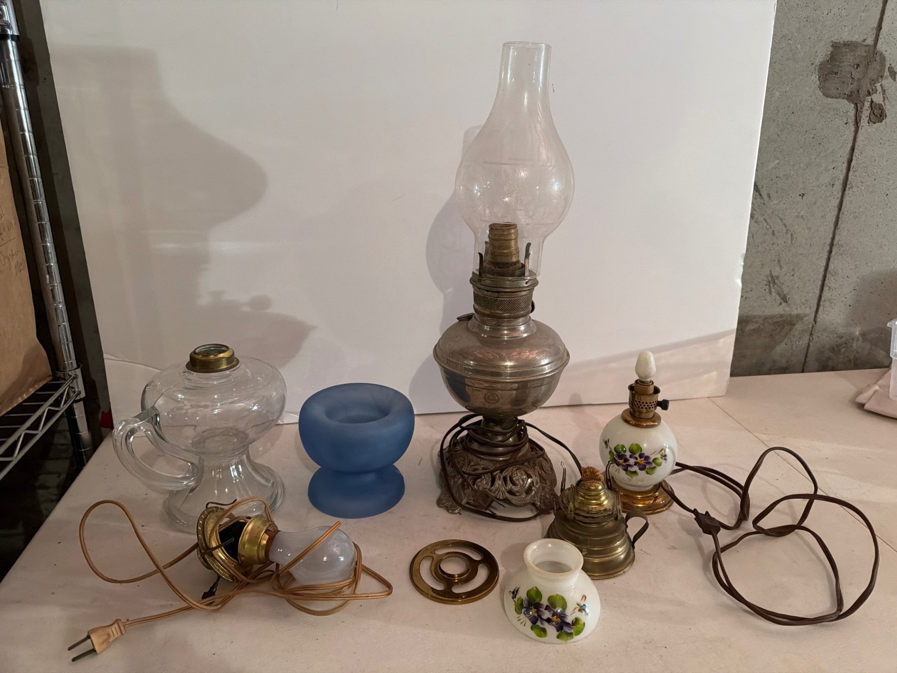 Antique oil lamps and decorative glassware  - image 1 of 13