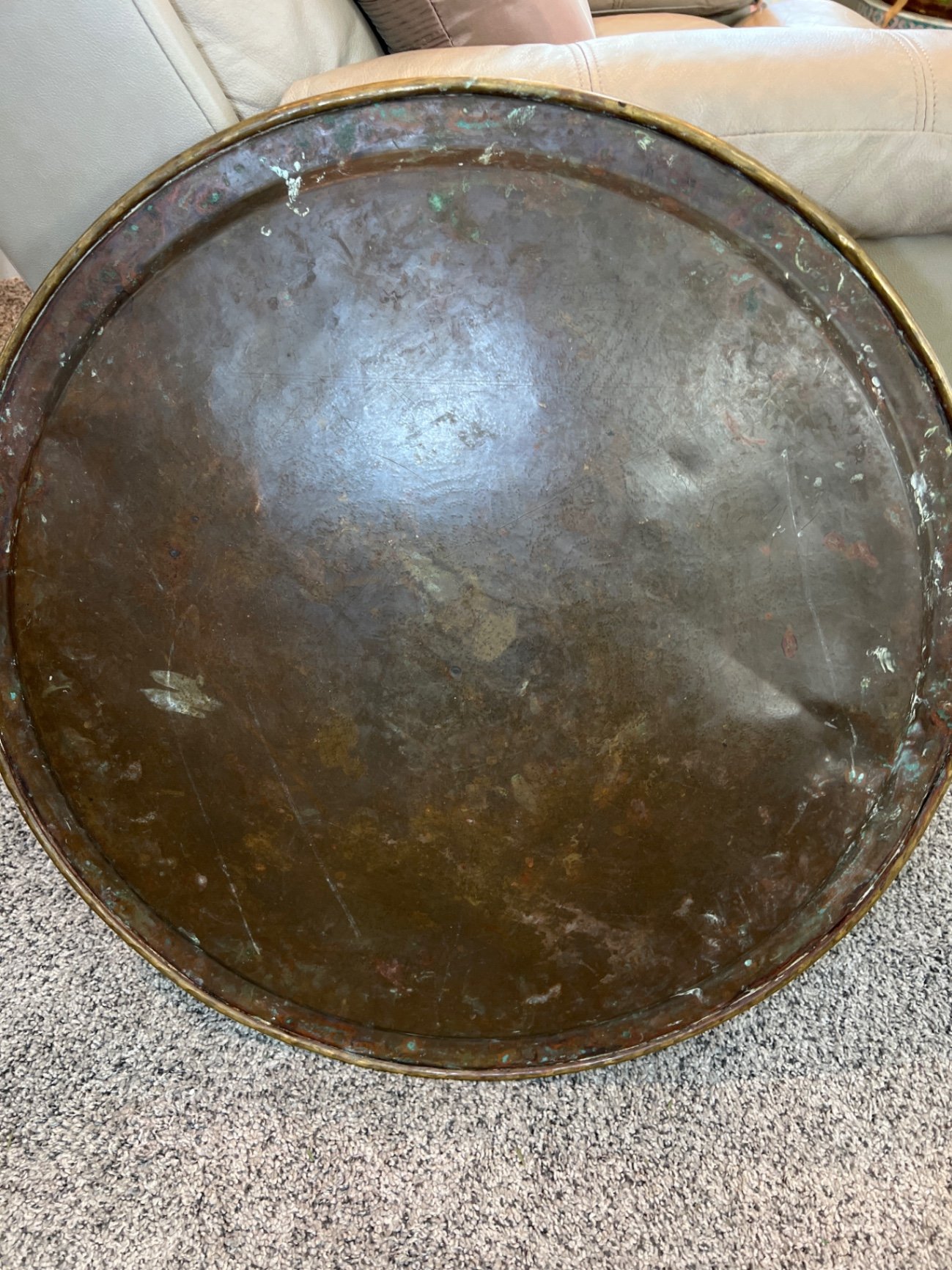Round brass engraved tray/table with carved wooden chair frame, and red patterned rug - image 8 of 11