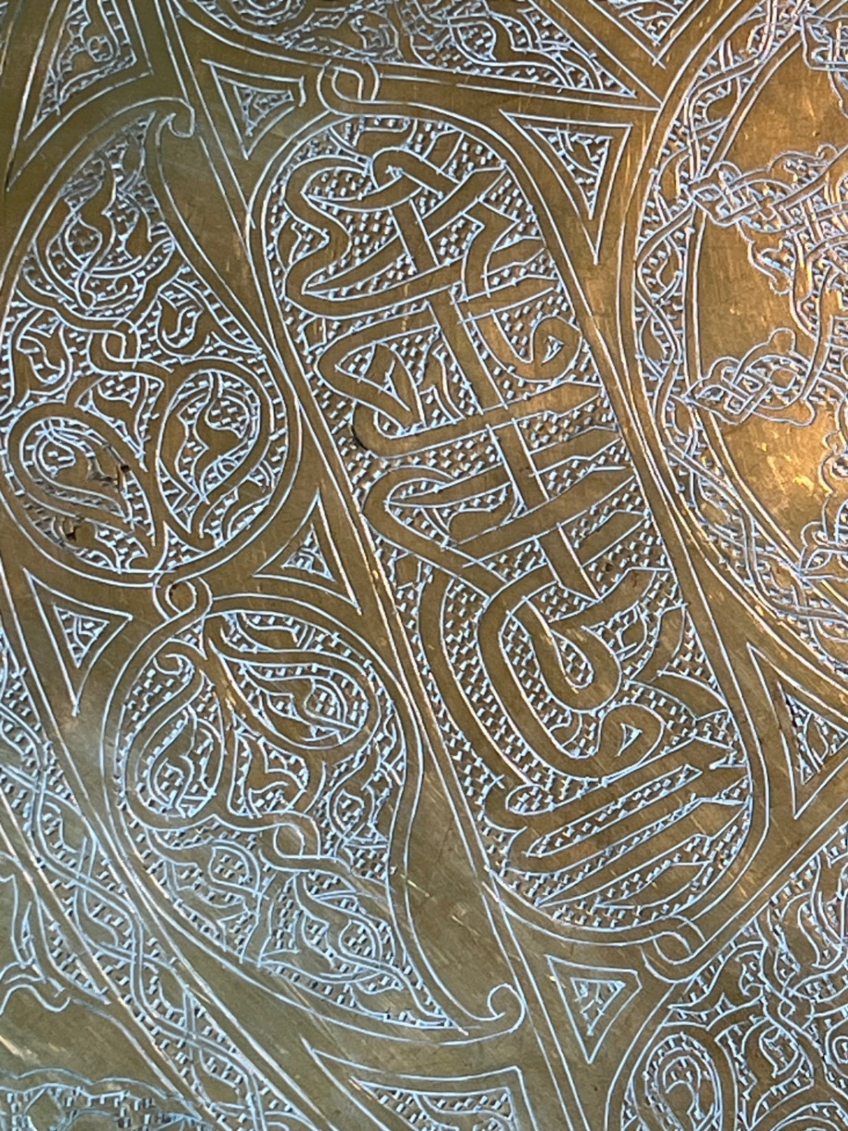 Round brass engraved tray/table with carved wooden chair frame, and red patterned rug - image 7 of 11