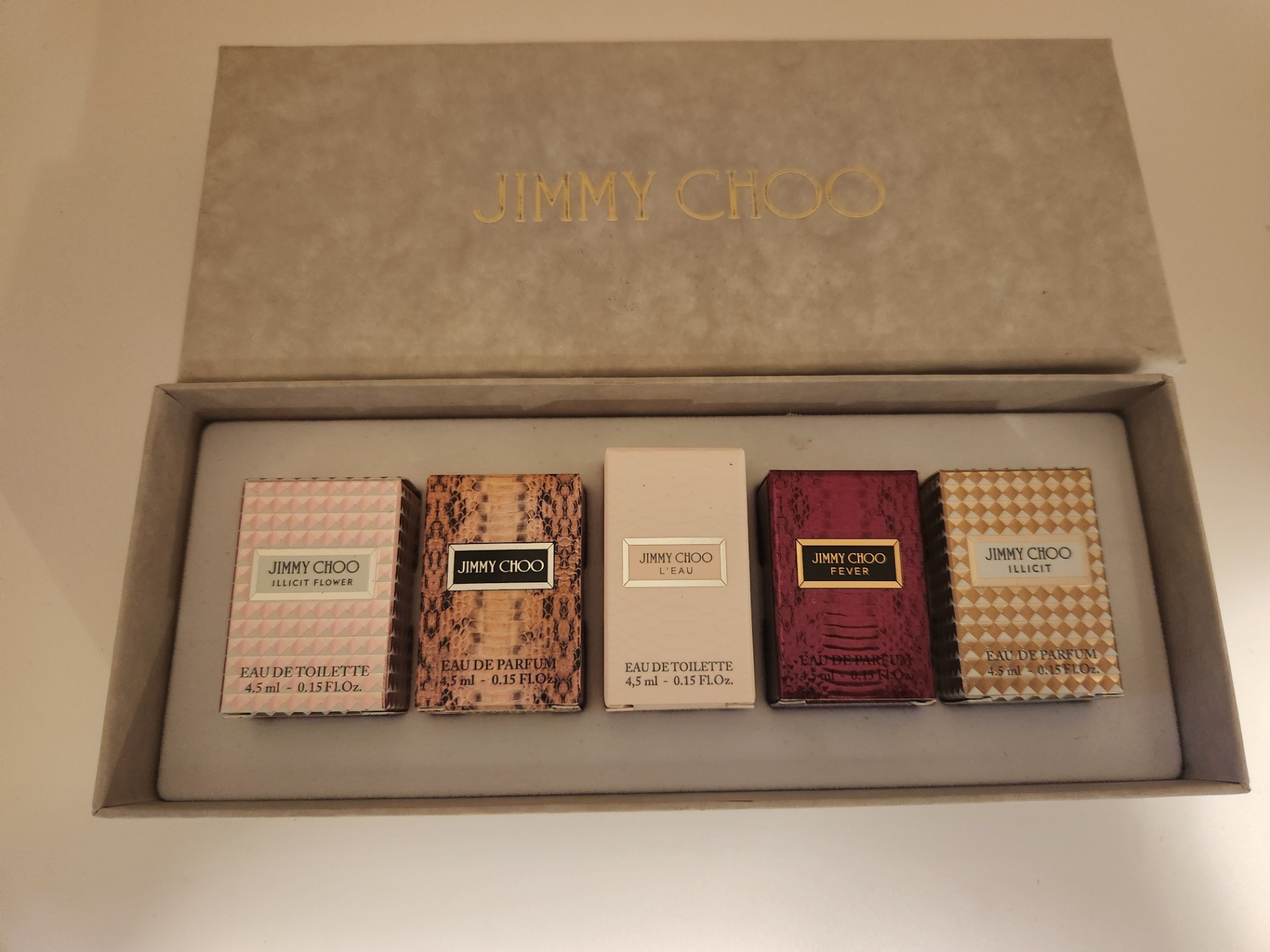 Jimmy Choo Mini Perfume Set — Illicit Flower, Jimmy Choo, L’Eau, Fever, Illicit (4.5 ml ea) New in Box and unusued - image 1 of 5