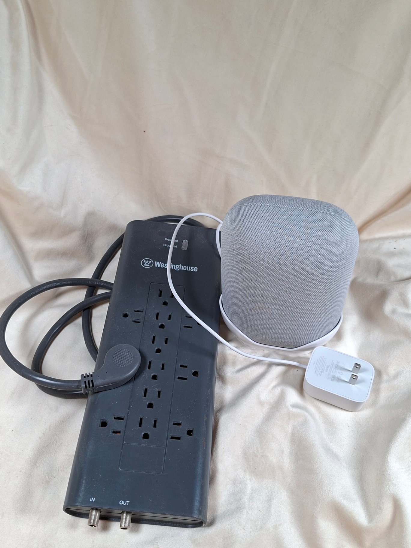 Westinghouse power strip with multiple outlets and a gray fabric-covered speaker - image 2 of 4