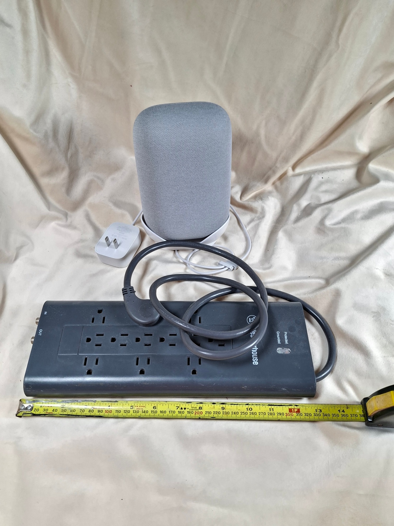 Westinghouse power strip with multiple outlets and a gray fabric-covered speaker - image 1 of 4