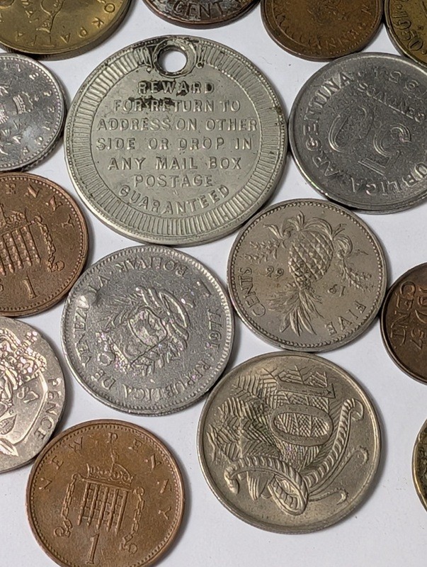 Assorted international coins and tokens - image 12 of 24