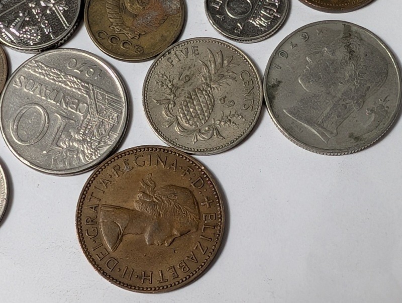 Assorted international coins and tokens - image 9 of 28