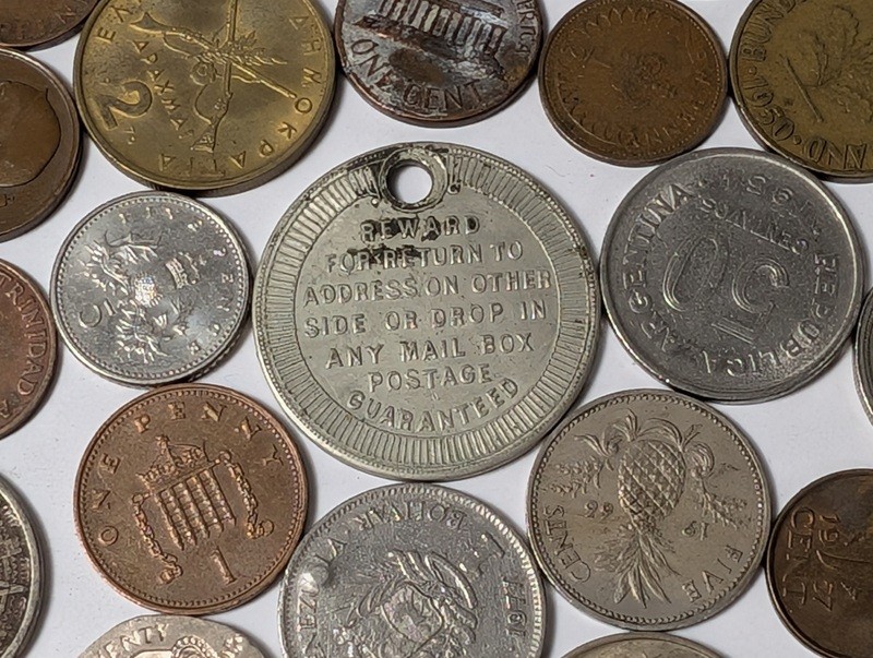 Assorted international coins and tokens - image 20 of 24
