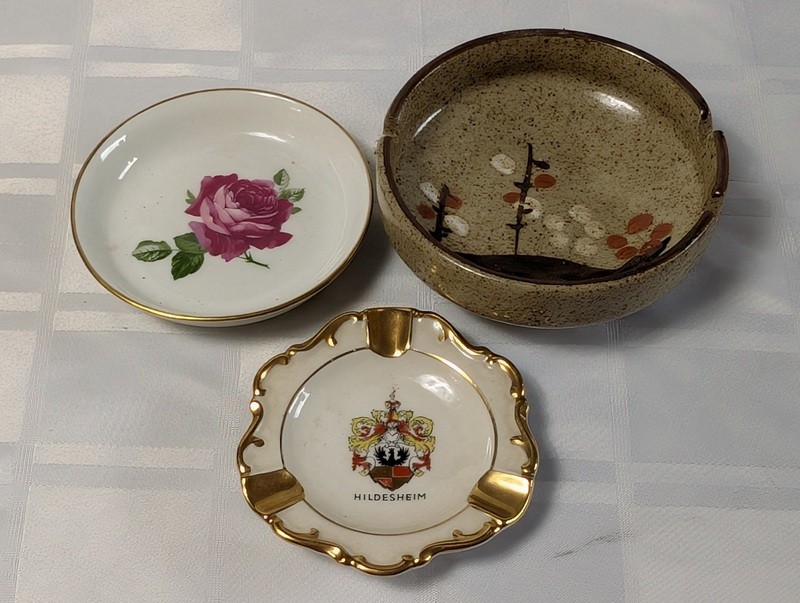 Assorted ceramic dishware with floral, heraldic, and landscape designs - image 1 of 16