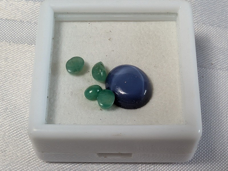 Green teardrop gemstones and a blue cabochon in display box - image 2 of 8