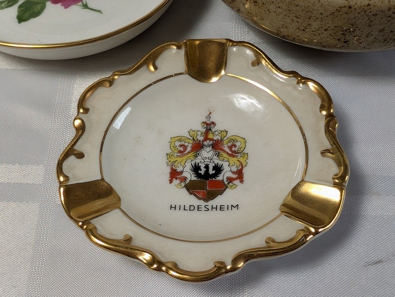 Assorted ceramic dishware with floral, heraldic, and landscape designs - image 2 of 16
