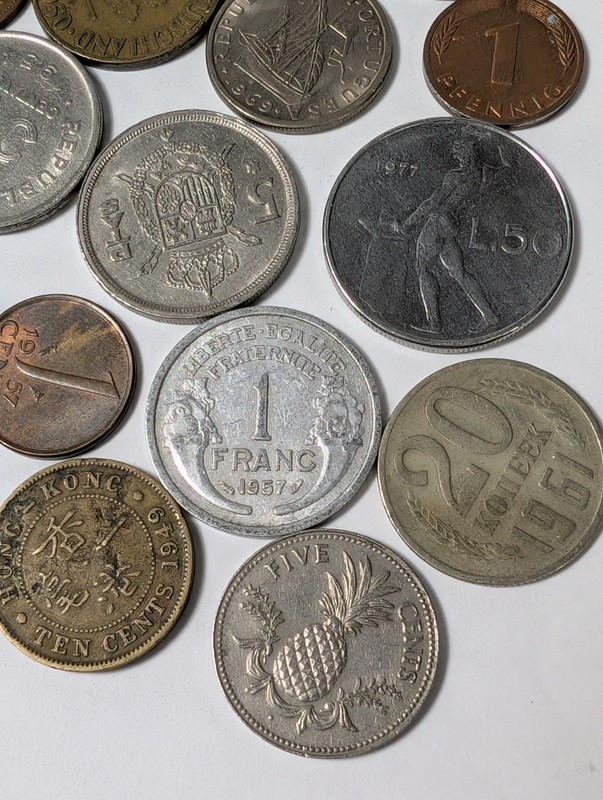 Assorted international coins and tokens - image 10 of 24