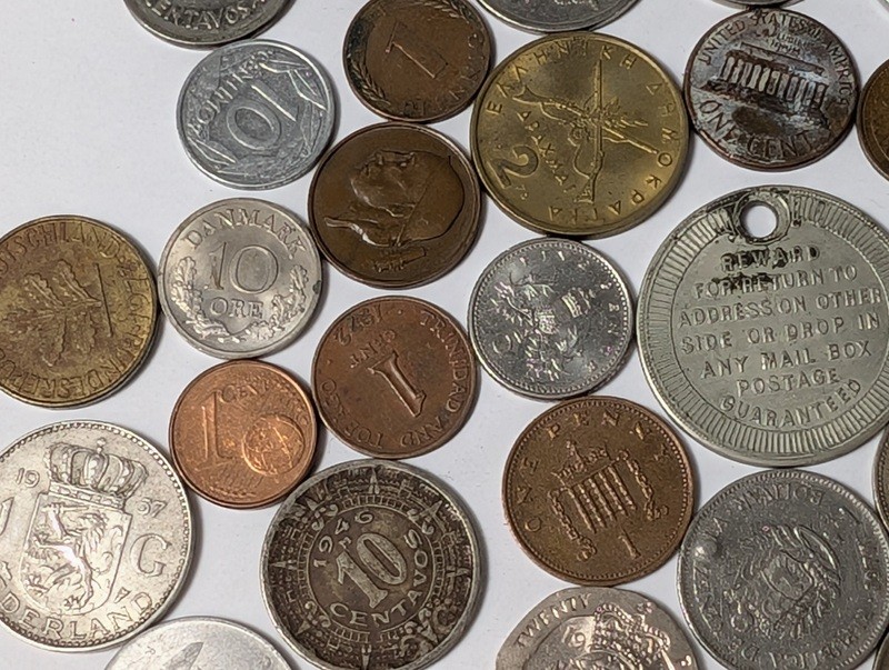 Assorted international coins and tokens - image 15 of 24