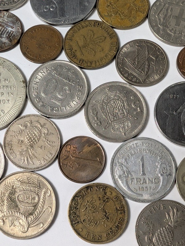Assorted international coins and tokens - image 11 of 24