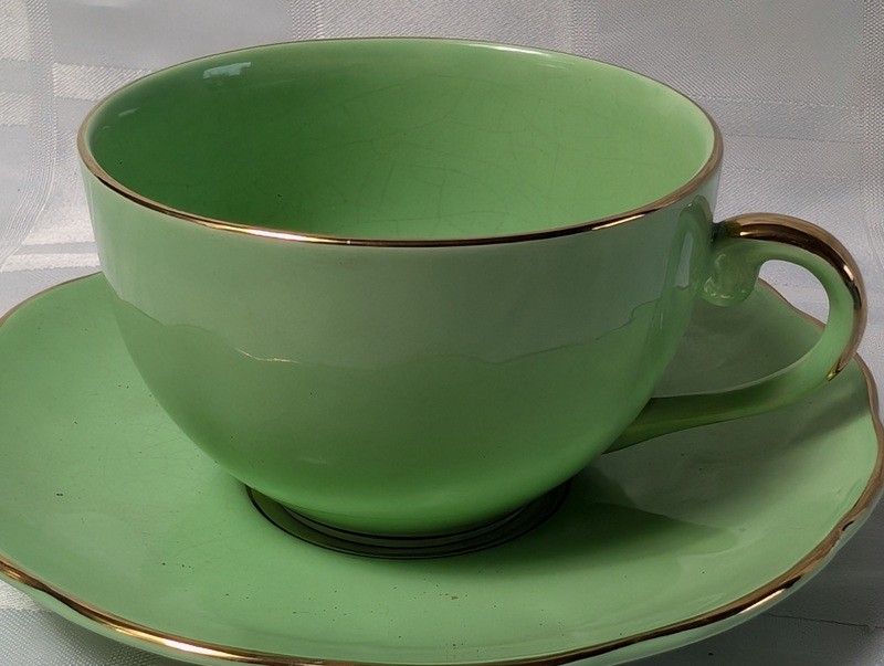 Green teacup and saucer set with gold trim - image 3 of 9