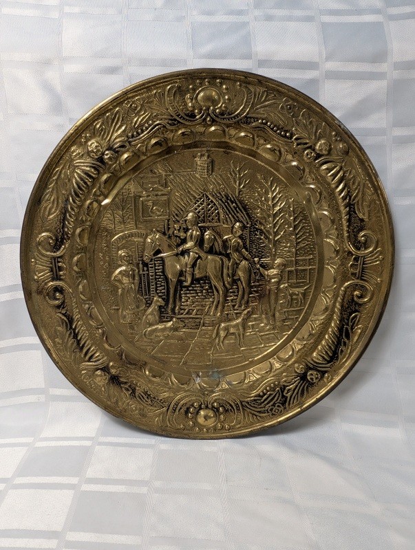 Round brass decorative plate with embossed medieval scene - image 1 of 10