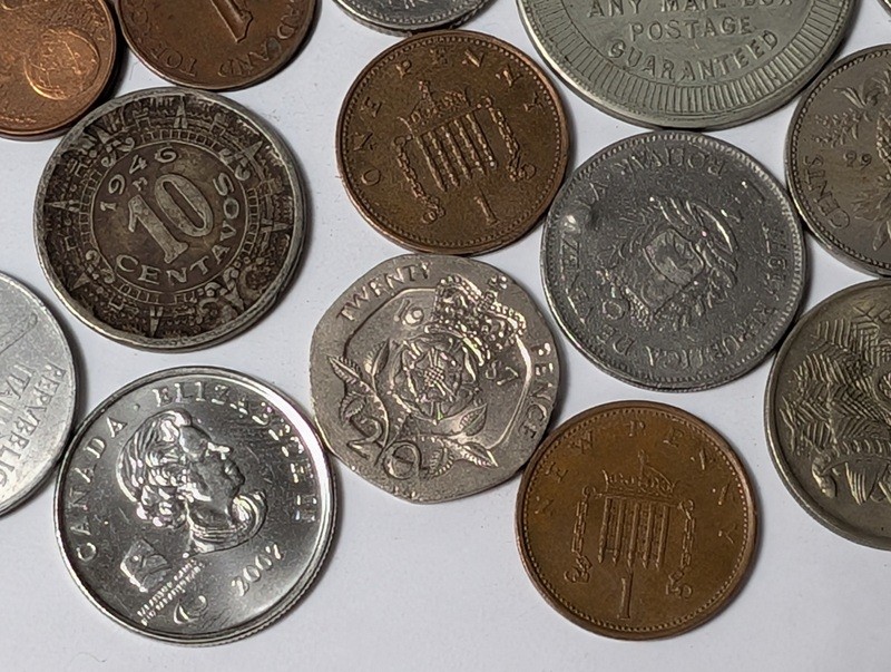 Assorted international coins and tokens - image 21 of 24