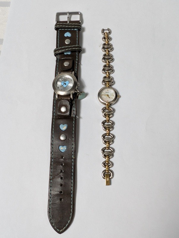 Bulova watches with heart motifs: leather cuff strap and two-tone bracelet - image 1 of 12