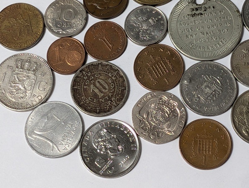 Assorted international coins and tokens - image 14 of 24