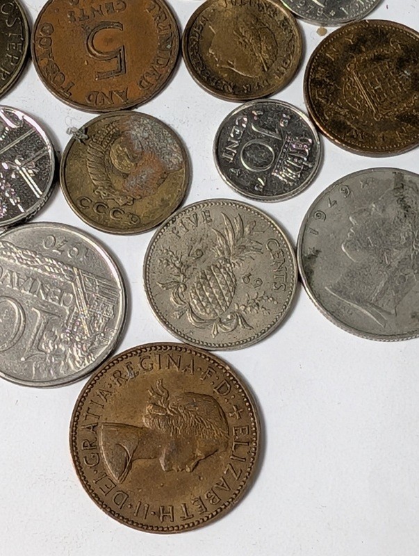 Assorted international coins and tokens - image 19 of 28