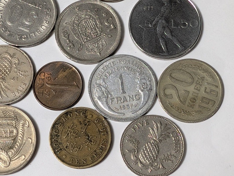 Assorted international coins and tokens - image 18 of 24