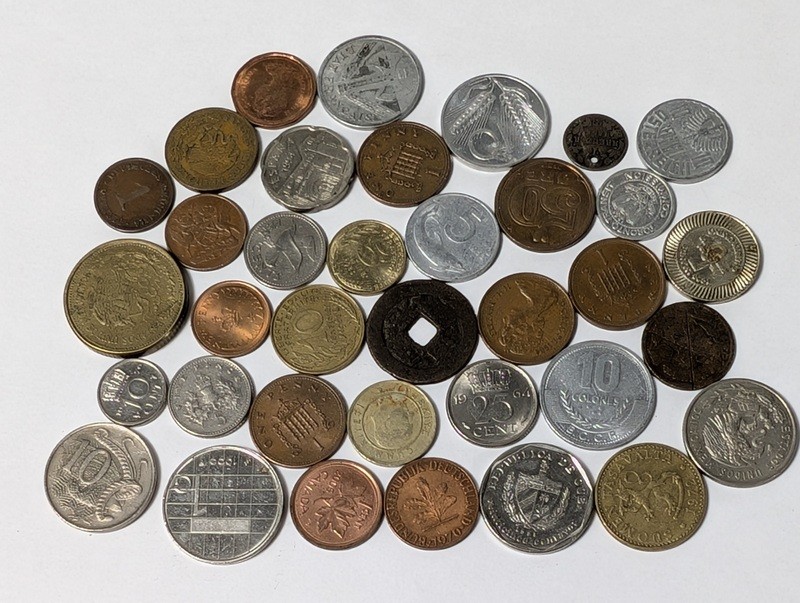 Assorted international coins - image 1 of 24