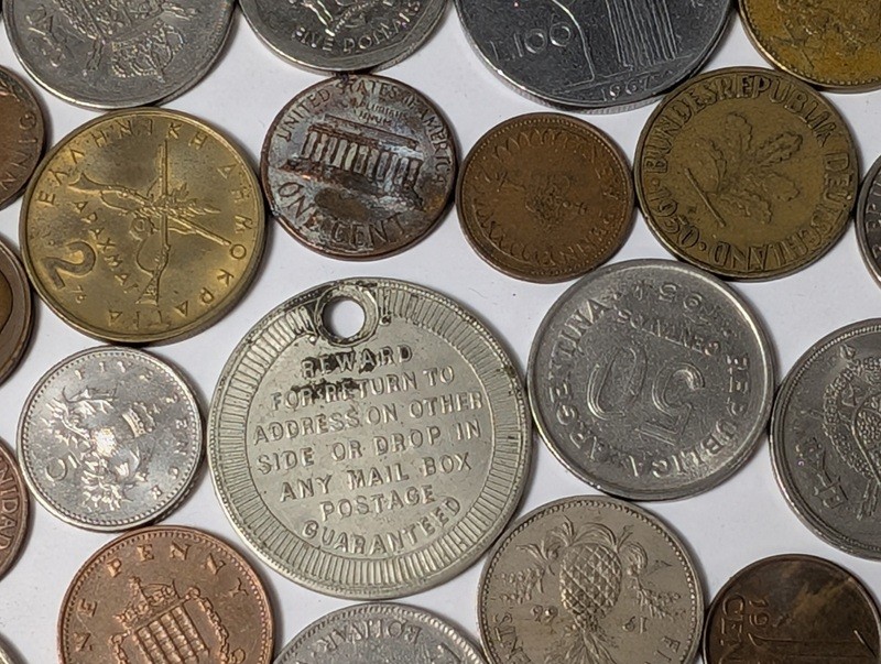 Assorted international coins and tokens - image 16 of 24