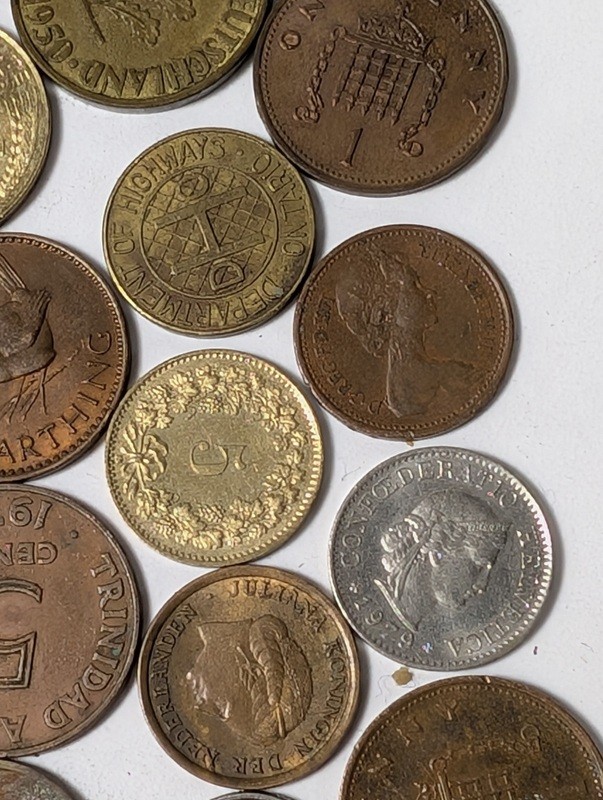 Assorted international coins and tokens - image 21 of 28