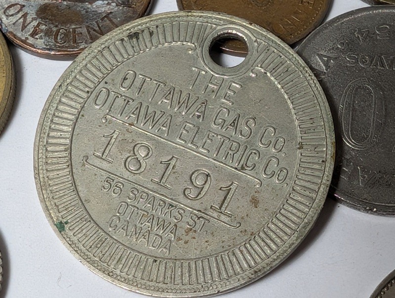 Assorted international coins and tokens - image 24 of 24