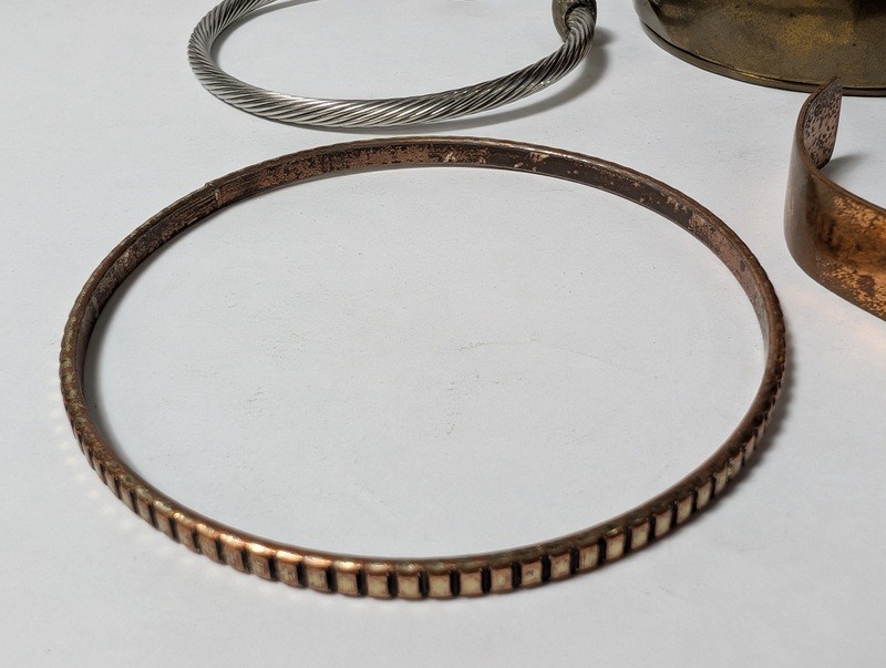 Assorted copper and metal bracelets and bangles - image 3 of 14