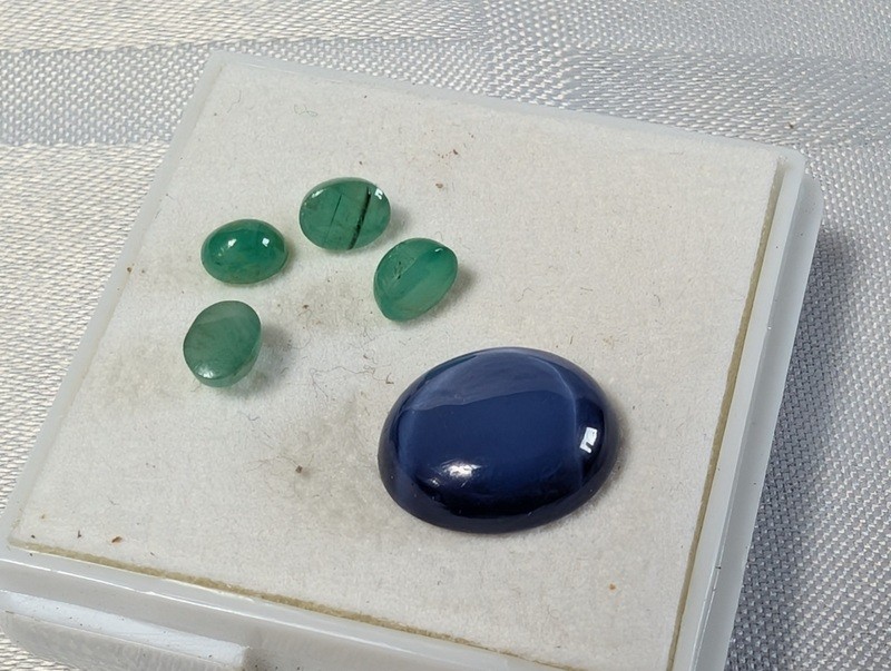 Green teardrop gemstones and a blue cabochon in display box - image 3 of 8
