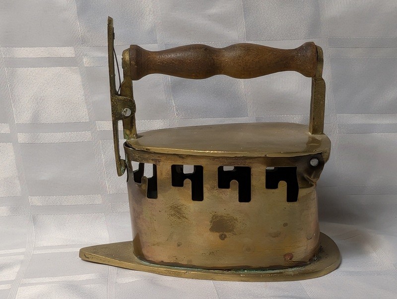 Antique brass coal iron with wooden handle - image 1 of 19