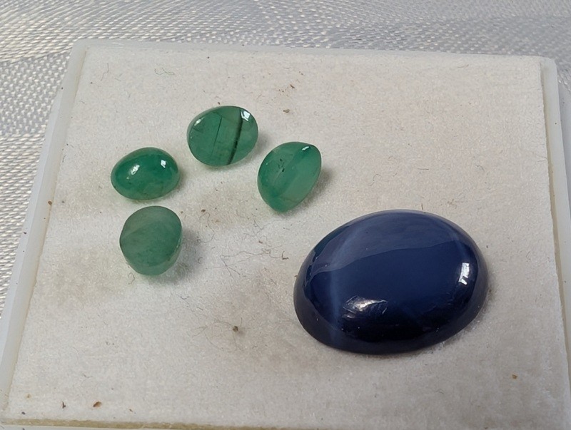 Green teardrop gemstones and a blue cabochon in display box - image 6 of 8