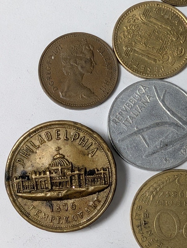 Assorted international coins and tokens - image 28 of 28