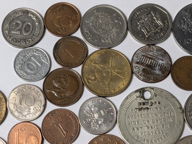 Assorted international coins and tokens - image 22 of 24