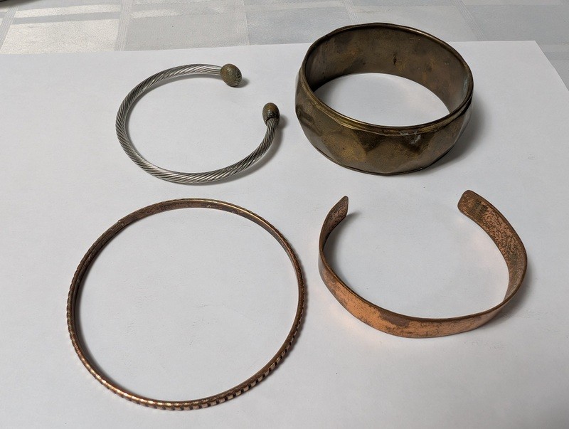 Assorted copper and metal bracelets and bangles - image 1 of 14