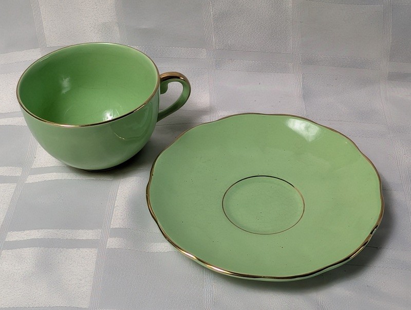 Green teacup and saucer set with gold trim - image 4 of 9