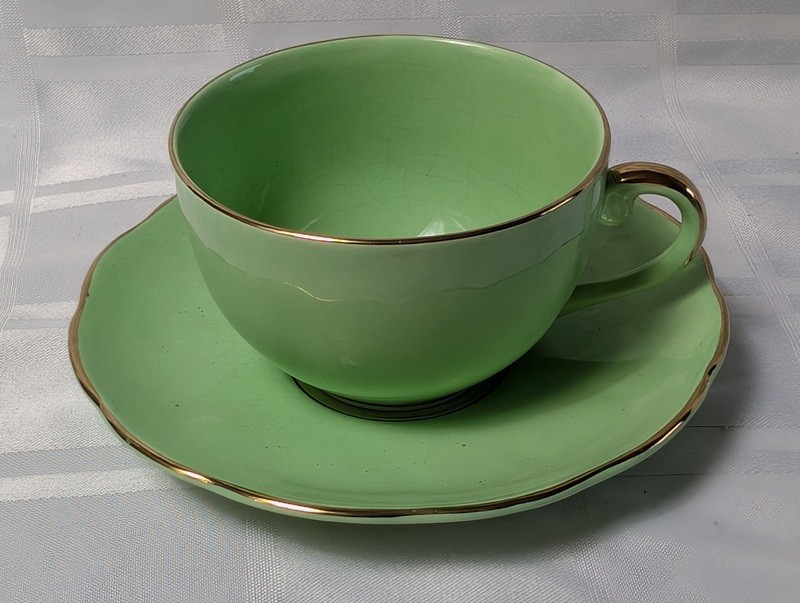 Green teacup and saucer set with gold trim - image 2 of 9