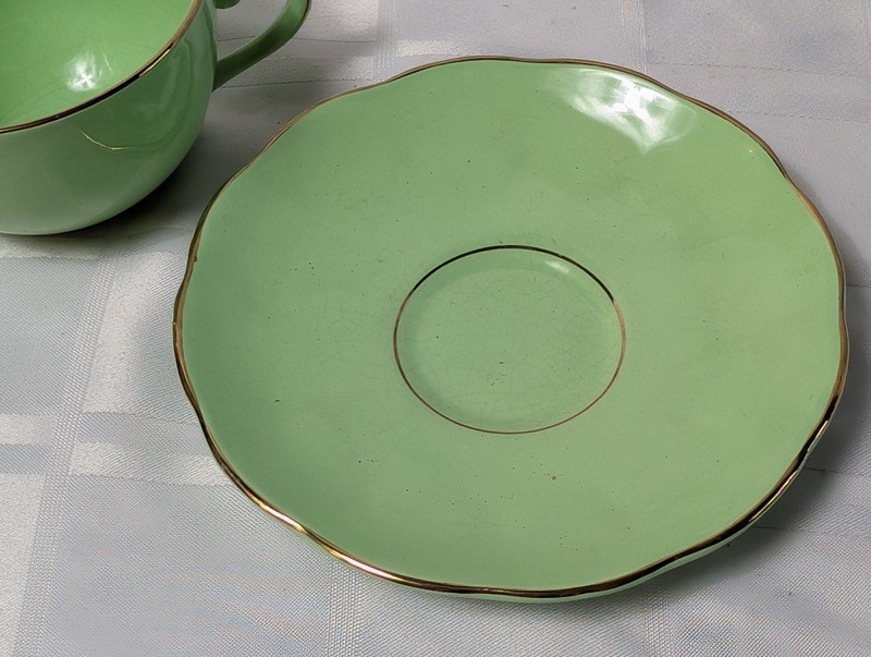 Green teacup and saucer set with gold trim - image 5 of 9