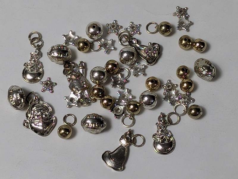 Assorted metal charms and beads (astronaut, bells, stars) - image 1 of 15