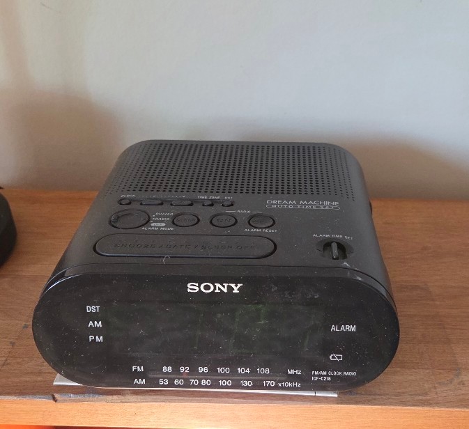 Table lamp with black pleated shade and Sony Dream Machine alarm clock - image 3 of 4