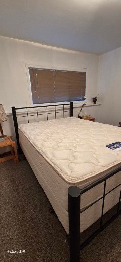 Metal-framed bed with mattress - image 2 of 2