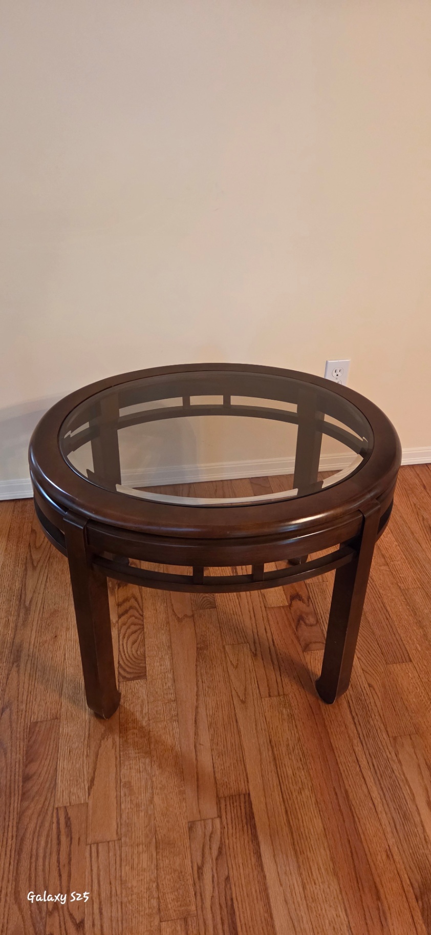 Round glass-top coffee table - image 1 of 3