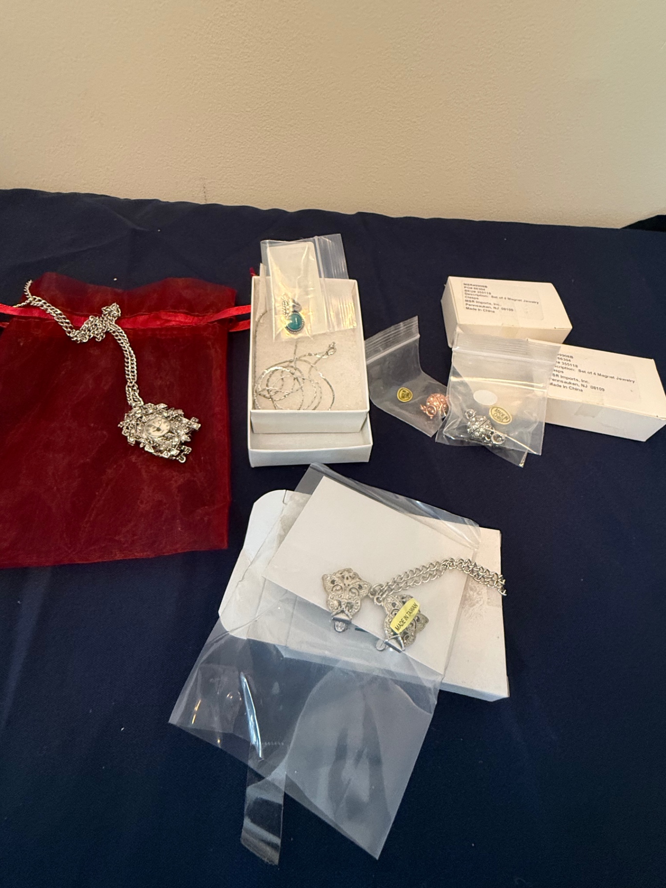 Silver-tone jewelry set with turquoise pendant, bracelet, and assorted charms - image 1 of 6