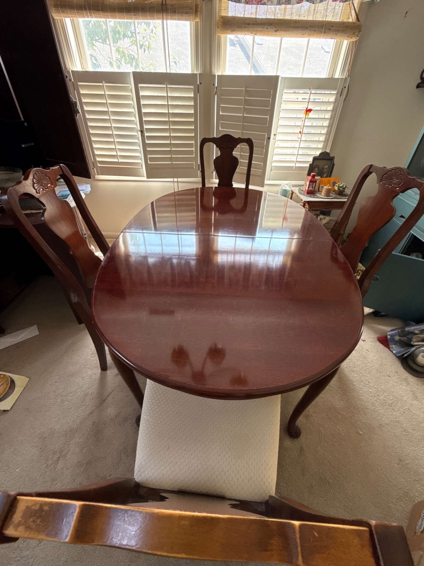Oval wooden dining table with chairs - image 1 of 3