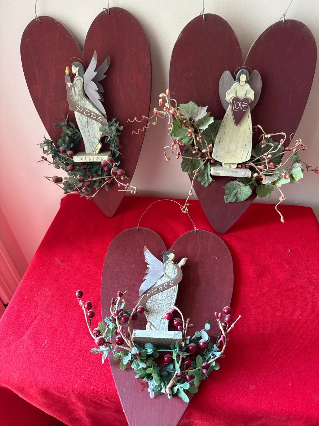 Three rustic wooden heart ornaments with angel figurines - image 1 of 3