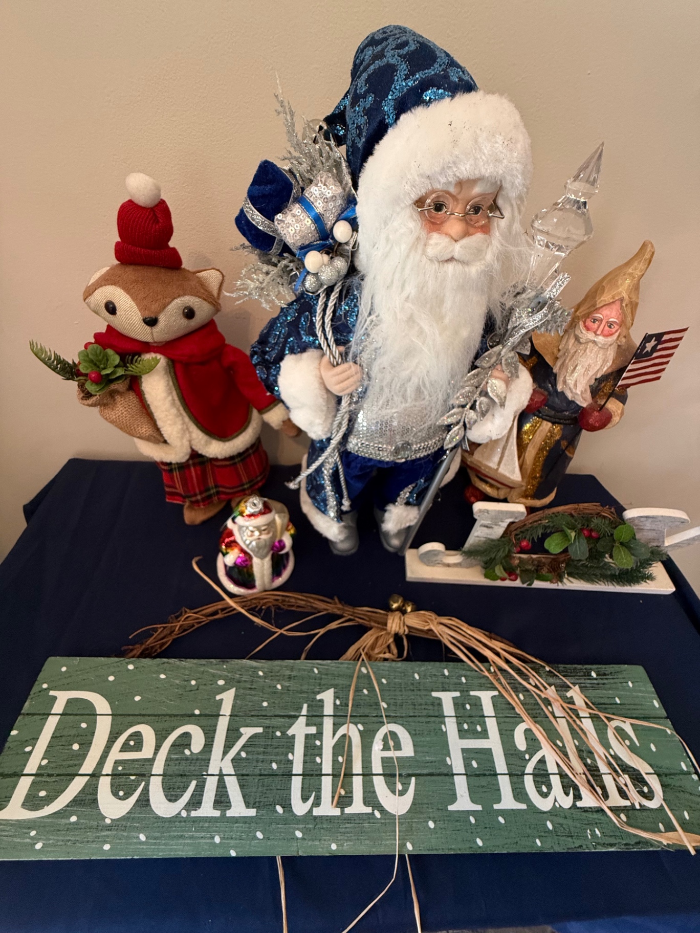 Deck the Halls holiday display with Santa figures and surroundings - image 5 of 5