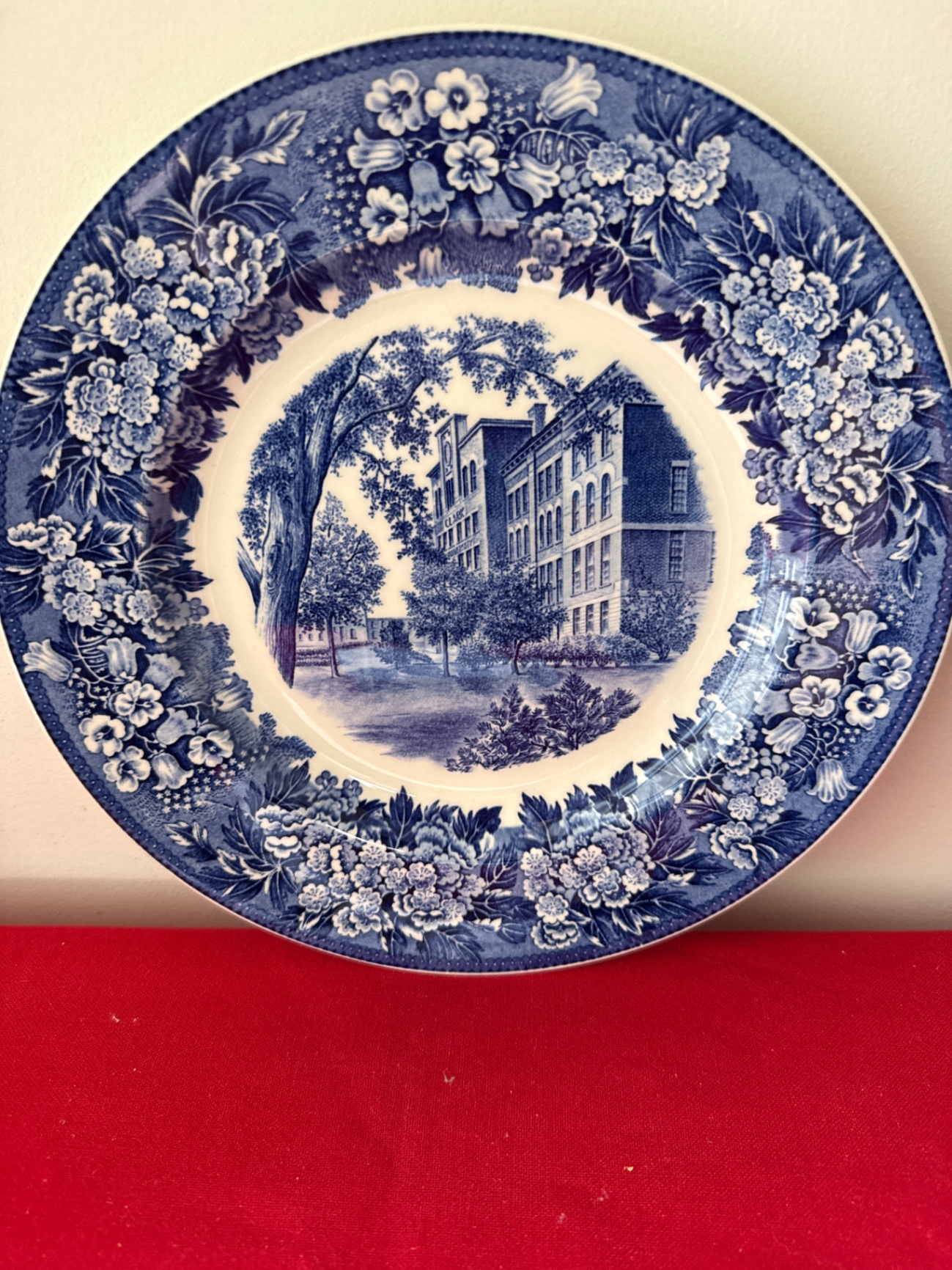 Blue and white decorative plate with Clark University Worcester town scene and floral border - image 1 of 3