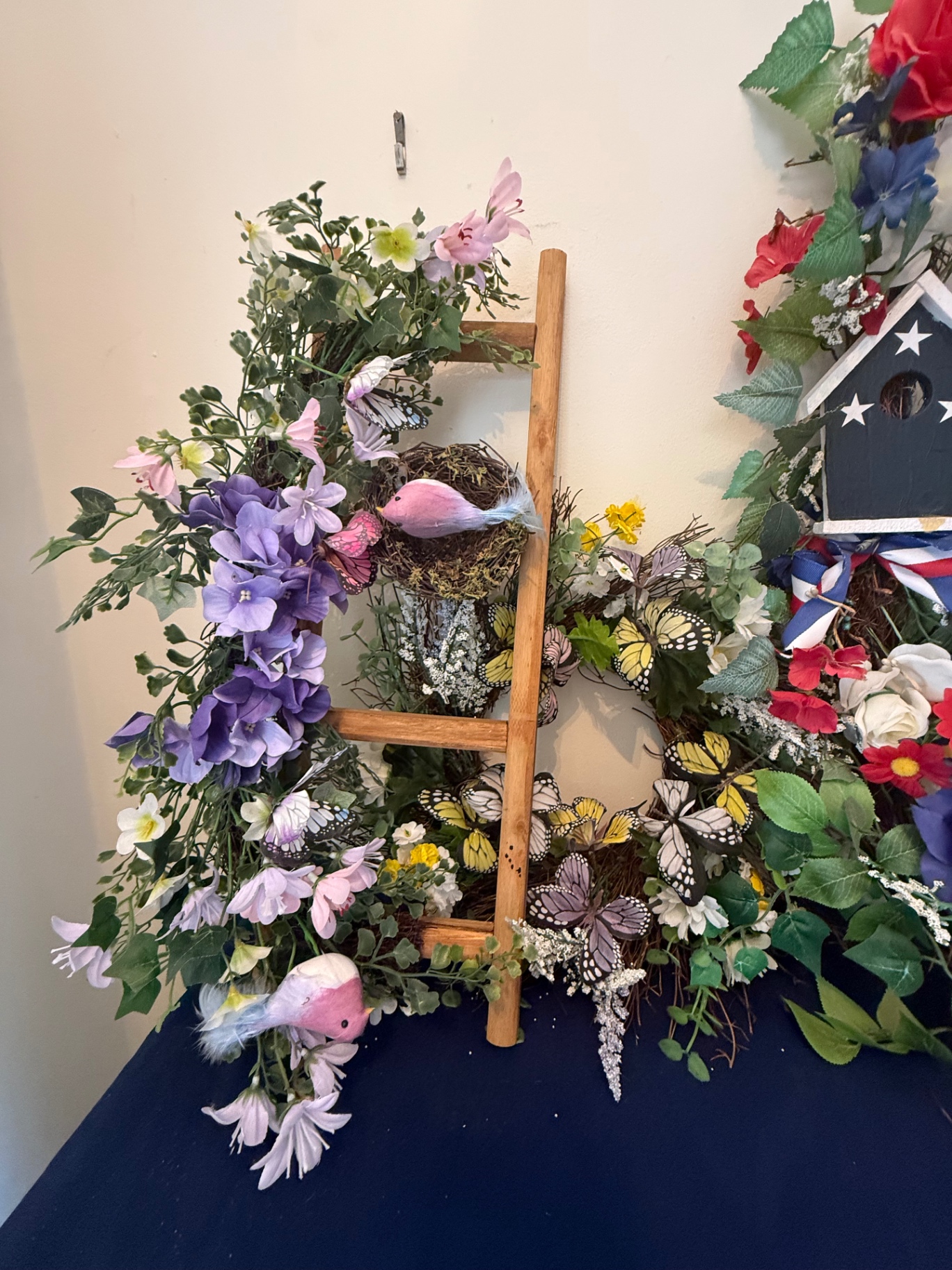 Multiple  floral wreaths with birdhouse and ladder - image 2 of 4