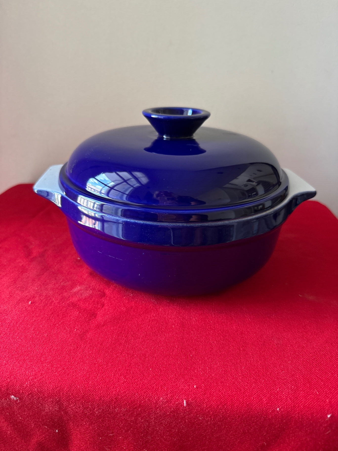 Blue Emile Henry lidded casserole with white ceramic dish - image 1 of 4