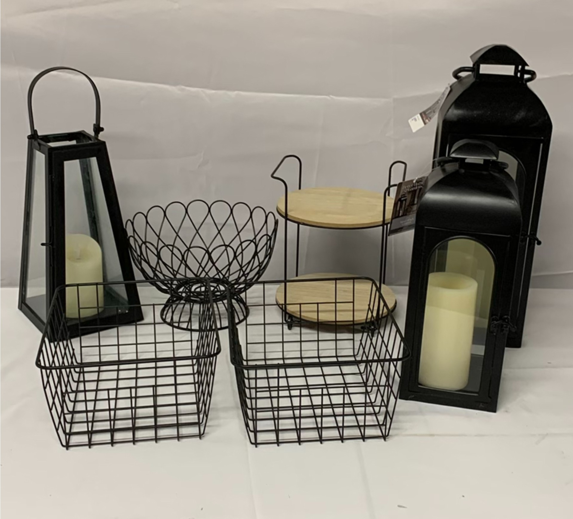 Black metal lanterns, wire baskets, and wooden tray stand - image 1 of 5